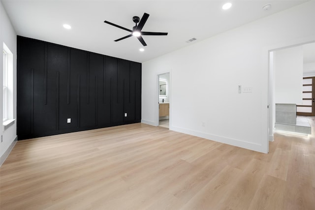 3900 De Maggio Ave, Dallas, TX 75210 - unfurnished bedroom with light wood-type flooring, recessed lighting, a ceiling fan, and connected bathroom