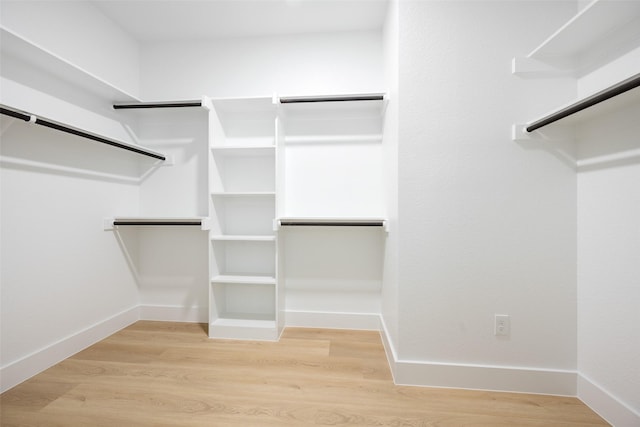 3900 De Maggio Ave, Dallas, TX 75210 - walk in closet with wood finished floors