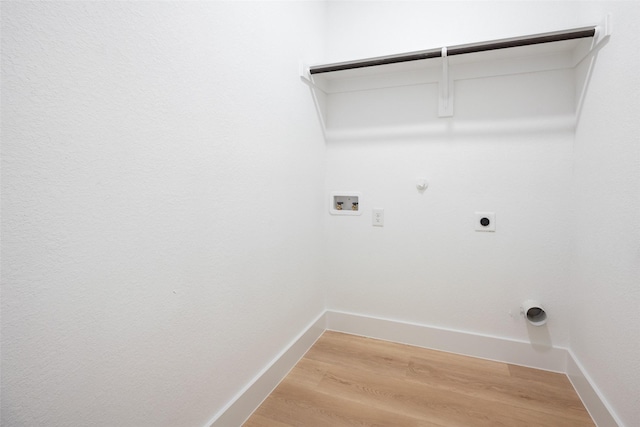 3900 De Maggio Ave, Dallas, TX 75210 - laundry room with gas dryer hookup, hookup for an electric dryer, hookup for a washing machine, and light wood-style floors