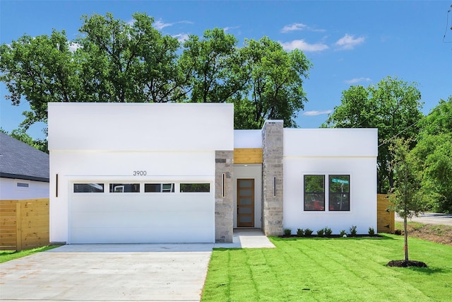 3900 De Maggio Ave, Dallas, TX 75210 - contemporary house with driveway, stucco siding, and a garage