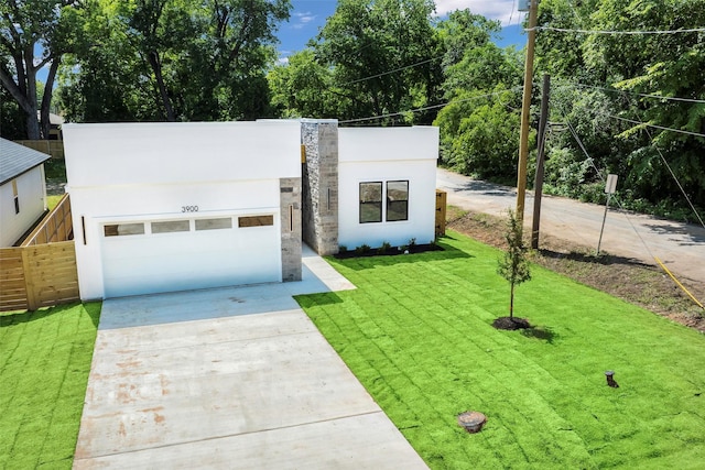 3900 De Maggio Ave, Dallas, TX 75210 - contemporary home with driveway, stucco siding, and a garage
