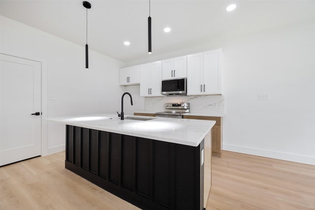 3900 De Maggio Ave, Dallas, TX 75210 - kitchen featuring stainless steel appliances, light wood-type flooring, white cabinetry, hanging light fixtures, and recessed lighting