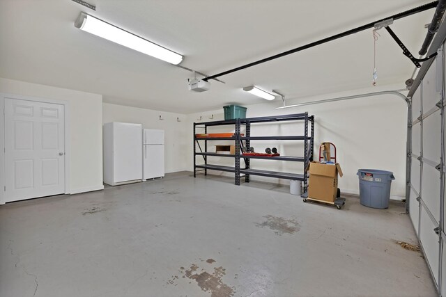 garage with freestanding refrigerator