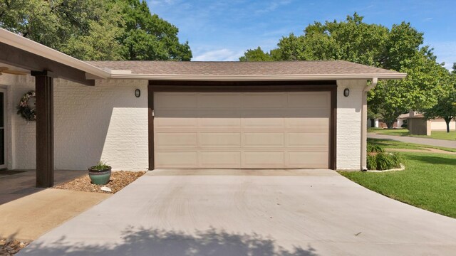 garage featuring driveway