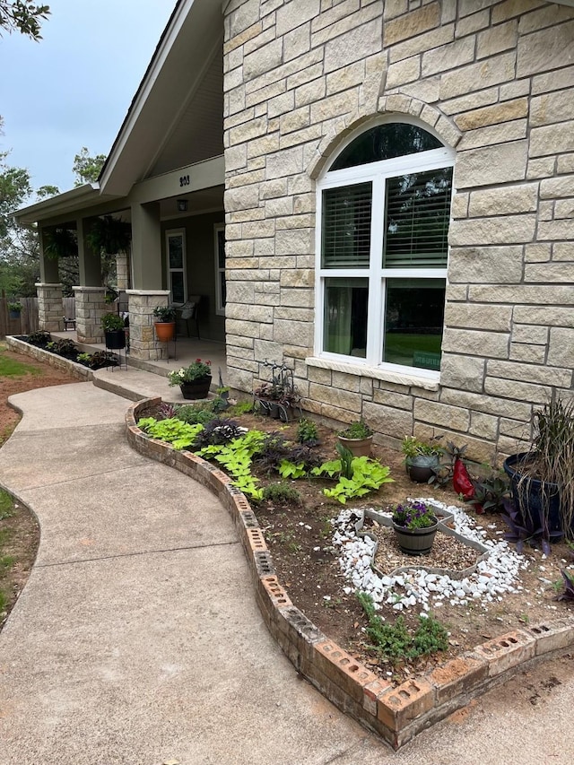 property entrance featuring stone siding
