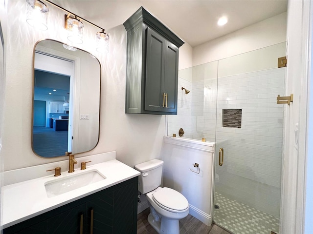 823 Wind River Pass, Azle, TX 76020 - bathroom with a shower stall, toilet, vanity, and wood finished floors