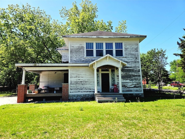 1208 W Broadway, Clarksville, TX 75426 - view of front of property with a front lawn and a carport