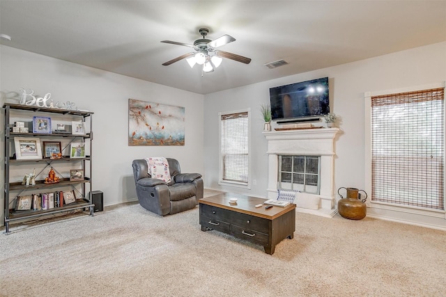 558 Ascot Way, Azle, TX 76020 - carpeted living room featuring a ceiling fan, baseboards, and a glass covered fireplace
