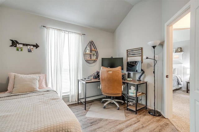 558 Ascot Way, Azle, TX 76020 - bedroom featuring multiple windows, lofted ceiling, wood finished floors, and a desk