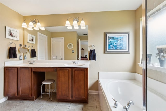 2377 Sunshine Dr, Little Elm, TX 75068 - full bath with tile patterned floors, a garden tub, double vanity, and baseboards