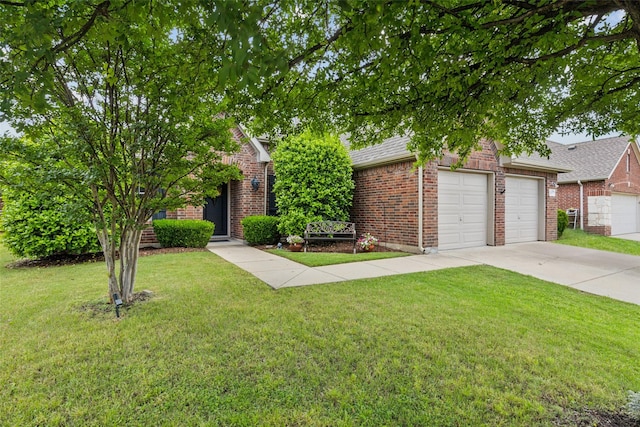 2377 Sunshine Dr, Little Elm, TX 75068 - view of property hidden behind natural elements featuring brick siding, concrete driveway, a front lawn, a garage, and a shingled roof