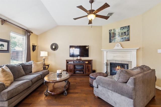 2377 Sunshine Dr, Little Elm, TX 75068 - living area with dark wood finished floors, ceiling fan, a tile fireplace, and vaulted ceiling