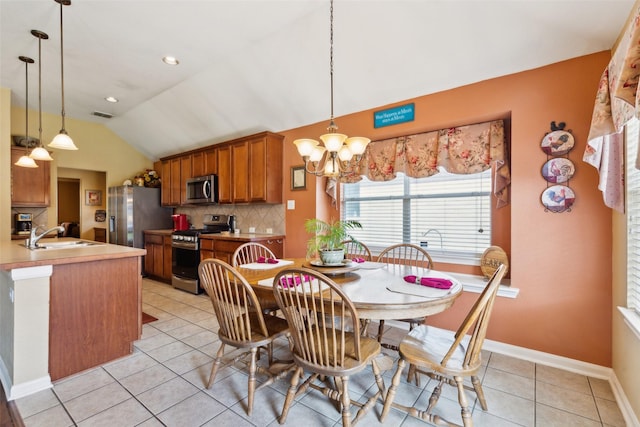 2377 Sunshine Dr, Little Elm, TX 75068 - dining area featuring lofted ceiling, light tile patterned floors, a chandelier, and baseboards