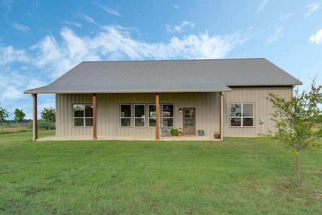 5050 Helton Rd, Justin, TX 76247 - view of front of house with a front yard, board and batten siding, and a metal roof