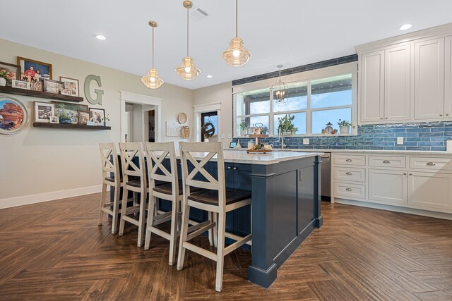 5050 Helton Rd, Justin, TX 76247 - kitchen with light countertops, a kitchen island, a kitchen breakfast bar, and recessed lighting