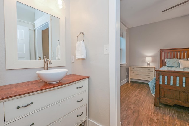 5050 Helton Rd, Justin, TX 76247 - bedroom with a sink, wood finished floors, and baseboards