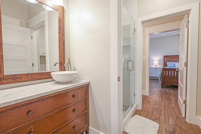 5050 Helton Rd, Justin, TX 76247 - ensuite bathroom with wood finished floors, a shower stall, vanity, and baseboards