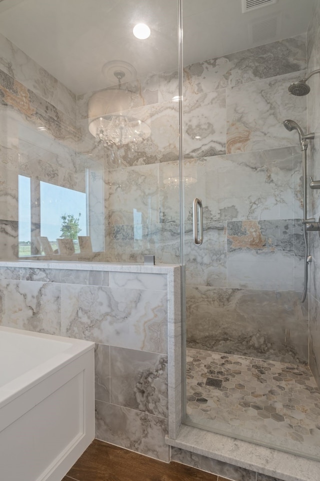 5050 Helton Rd, Justin, TX 76247 - full bathroom with a shower stall, wood finished floors, and tile walls