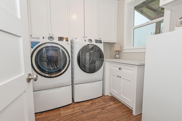 5050 Helton Rd, Justin, TX 76247 - washroom with cabinet space, independent washer and dryer, and dark wood-style floors
