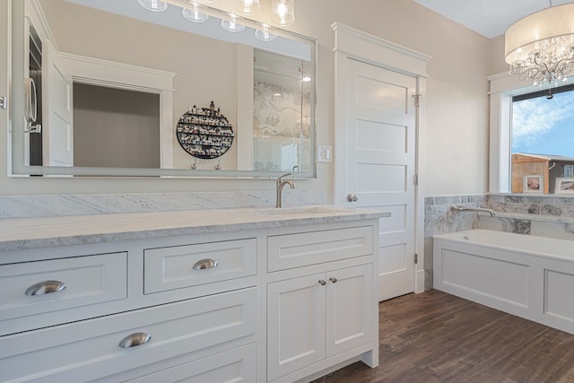 5050 Helton Rd, Justin, TX 76247 - full bathroom featuring a bath, vanity, wood finished floors, a chandelier, and a shower with shower door