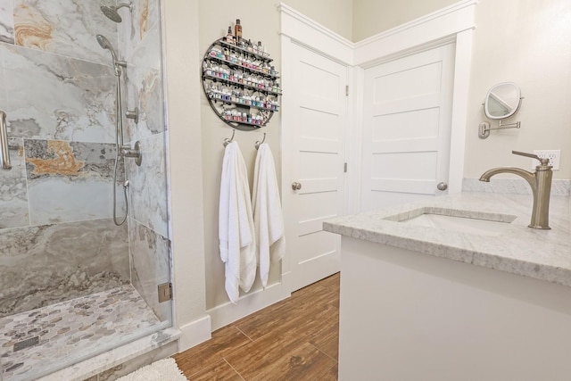 5050 Helton Rd, Justin, TX 76247 - bathroom featuring a marble finish shower, wood finished floors, and vanity