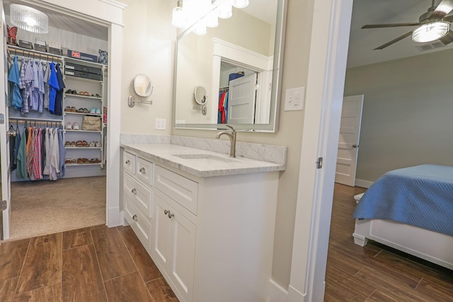 5050 Helton Rd, Justin, TX 76247 - full bath featuring ceiling fan, wood finished floors, vanity, and a walk in closet