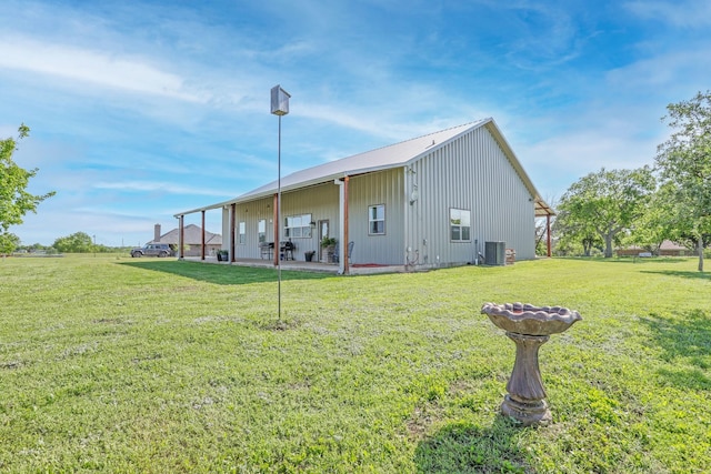 5050 Helton Rd, Justin, TX 76247 - back of property featuring central AC unit and a lawn