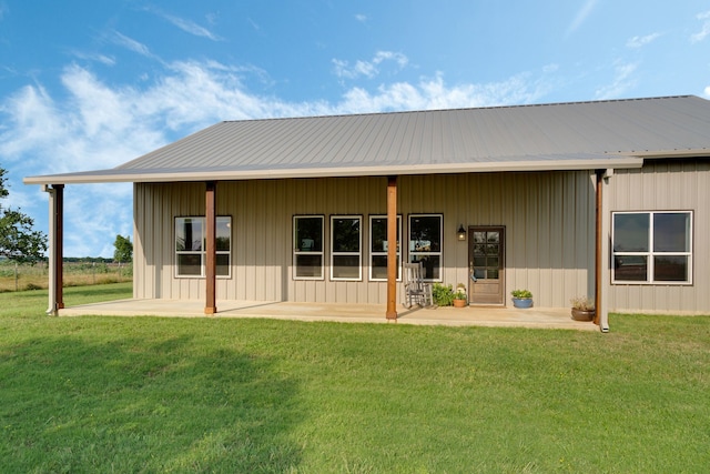 5050 Helton Rd, Justin, TX 76247 - rear view of house featuring a patio, a yard, and a metal roof