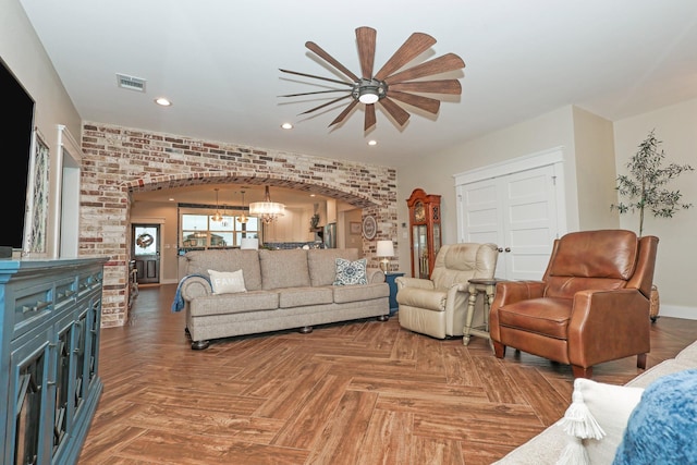 5050 Helton Rd, Justin, TX 76247 - living room featuring arched walkways, a ceiling fan, recessed lighting, a chandelier, and baseboards