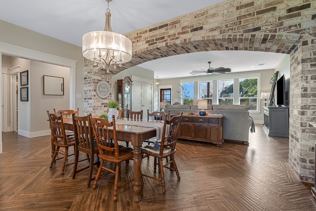 5050 Helton Rd, Justin, TX 76247 - dining space with a ceiling fan, arched walkways, and a chandelier