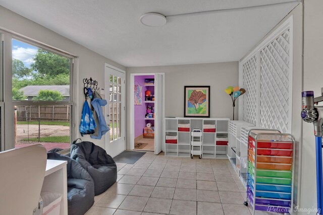 game room featuring light tile patterned floors
