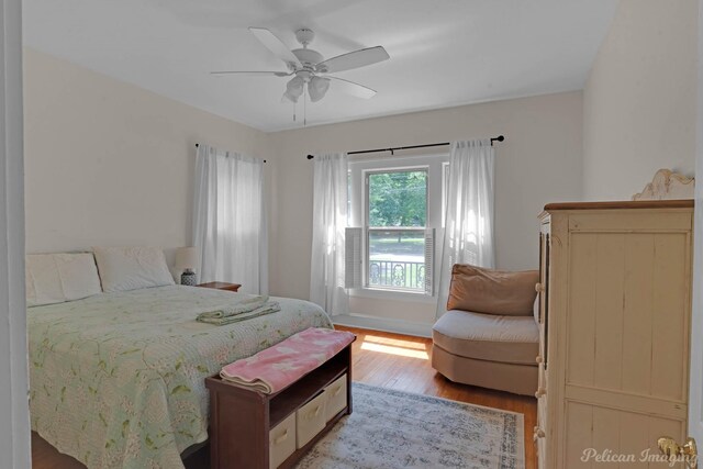 bedroom featuring wood finished floors and a ceiling fan