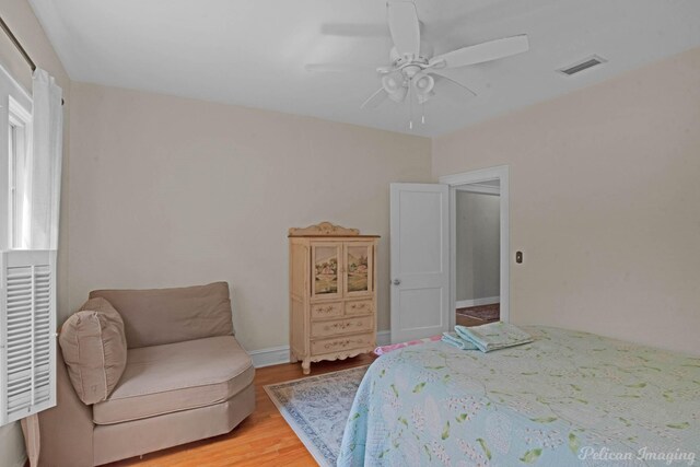 bedroom featuring light wood-style flooring and ceiling fan