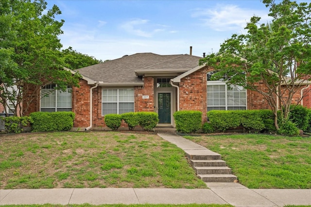 2617 Jacques Ln, Mckinney, TX 75070 - view of front of property featuring brick siding, a front lawn, and roof with shingles