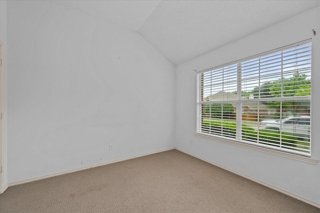 2617 Jacques Ln, Mckinney, TX 75070 - empty room with vaulted ceiling, light carpet, and baseboards