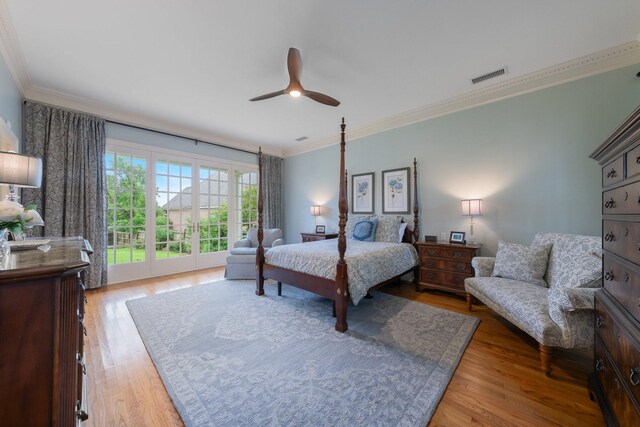 bedroom featuring wood finished floors, crown molding, and ceiling fan