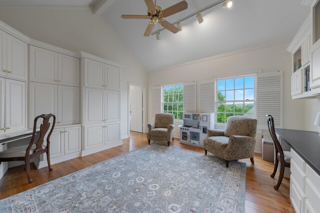 living area with an office area, light wood finished floors, ceiling fan, beamed ceiling, and high vaulted ceiling