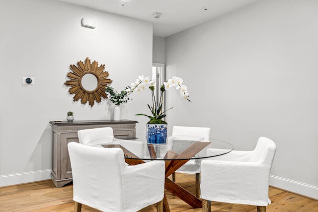 3420 Rosedale Ave Unit 6, University Park, TX 75205 - dining space with baseboards and light wood finished floors