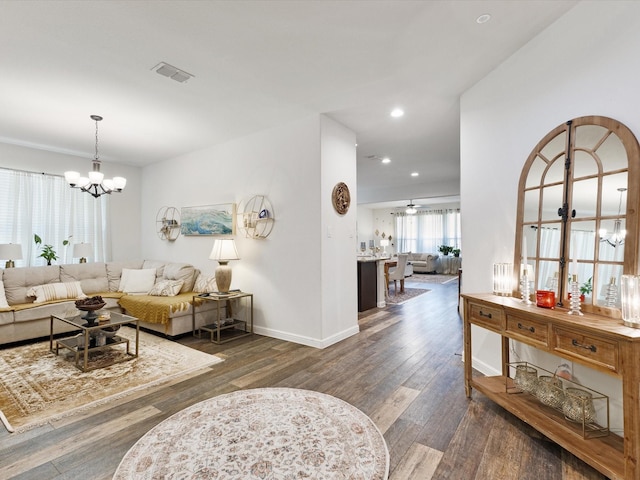 1111 Burlingame Dr, Cleburne, TX 76033 - living room with a chandelier, wood finished floors, baseboards, and recessed lighting