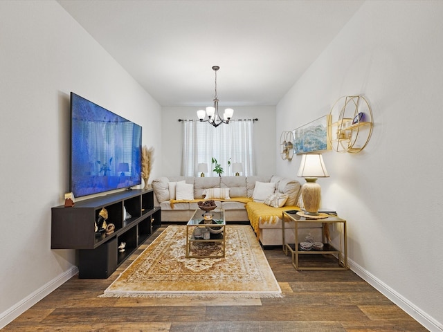 1111 Burlingame Dr, Cleburne, TX 76033 - living area featuring a chandelier, wood finished floors, and baseboards