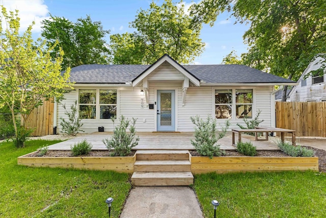 909 N 30th St, Waco, TX 76707 - view of front of house featuring roof with shingles and a wooden deck
