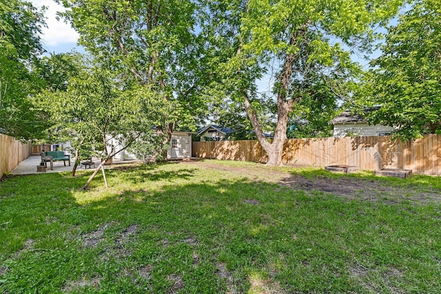 909 N 30th St, Waco, TX 76707 - view of yard featuring a storage unit, a patio area, and an outdoor structure