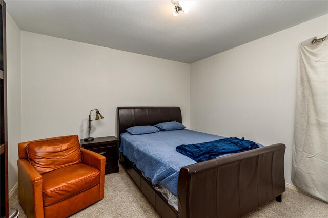 bedroom with light colored carpet