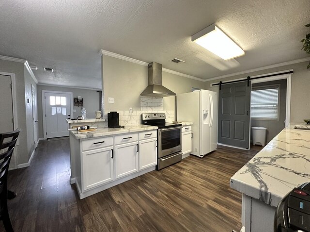 kitchen with electric stove, wall chimney range hood, white fridge with ice dispenser, a peninsula, and a barn door