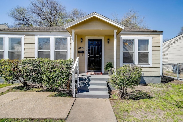 view of front of house with fence