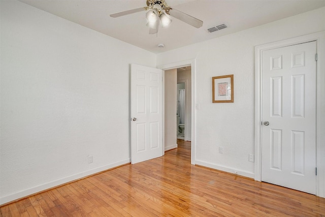 unfurnished bedroom with baseboards, light wood finished floors, and ceiling fan