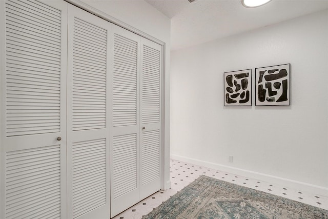 hall featuring baseboards