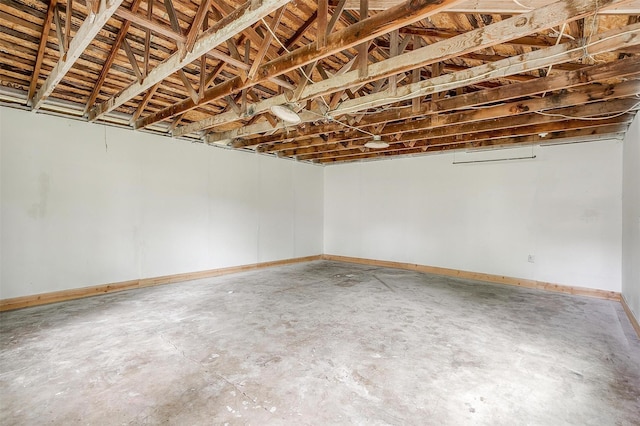 below grade area featuring baseboards