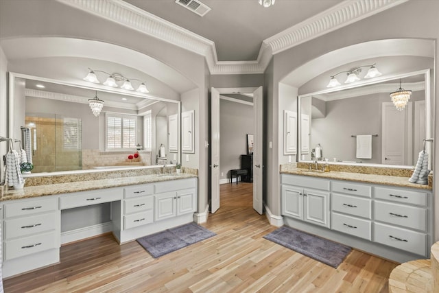 7208 Majestic Mnr, Colleyville, TX 76034 - full bathroom featuring crown molding, a shower stall, vanity, wood finished floors, and baseboards