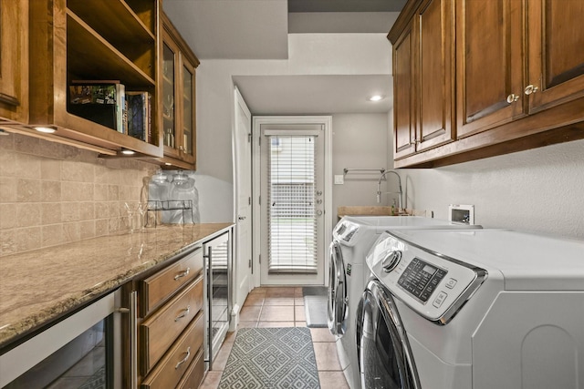 7208 Majestic Mnr, Colleyville, TX 76034 - laundry area featuring separate washer and dryer, wine cooler, cabinet space, and light tile patterned floors